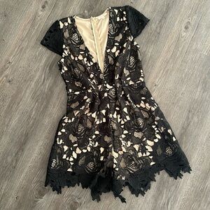 Black lace romper
Shorts, low cut chest